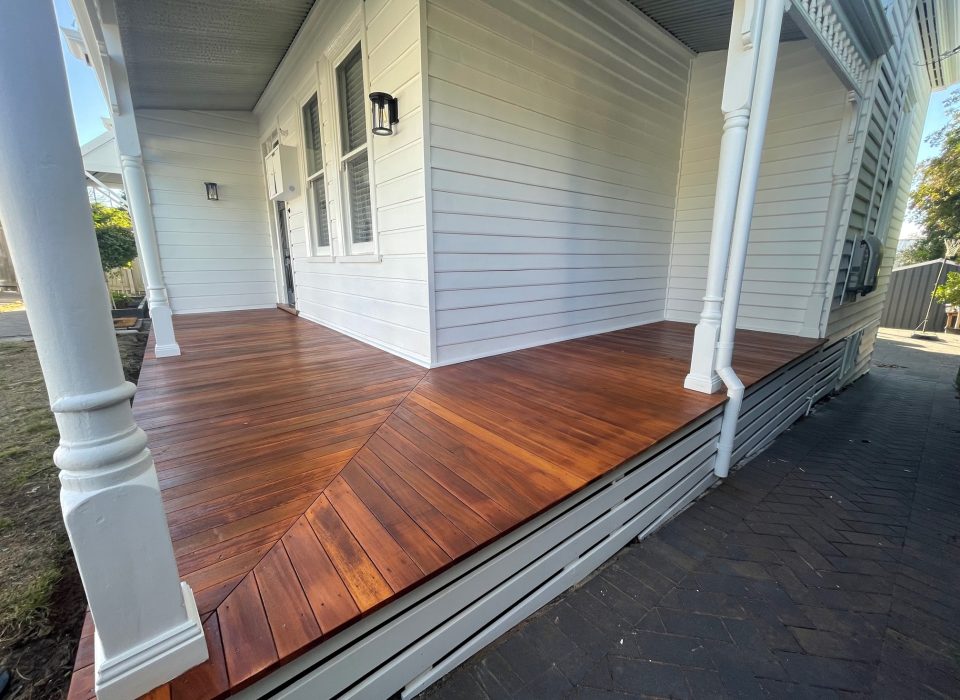 A newly-installed timber porch, attached to a renovated worker's cottage-style home